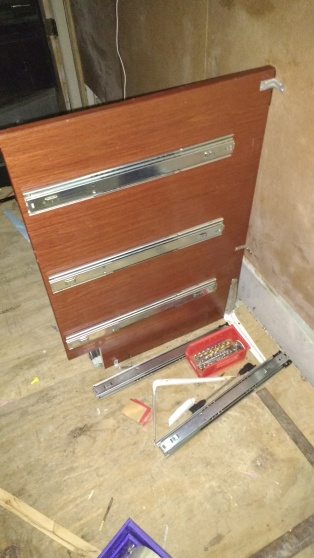 We started installing cabinets tonight. We built this side wall from a table top. The original cabinets were 26" high and 22" deep. The final counters will be 36" tall and 25" deep, which is why we needed to build custom side walls.
